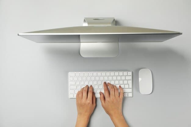 A close-up shot of a computer monitor positioned at eye-level on an adjustable monitor stand, showcasing the correct ergonomic placement with a keyboard and mouse within easy reach.