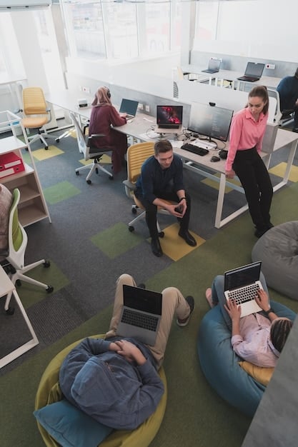 A crowded coworking space with people working on laptops, some looking stressed and overwhelmed.