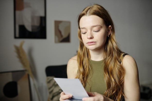 A freelancer reviewing a list of unpaid invoices on a tablet, with a concerned expression. A smartphone displaying an email with payment reminder is also visible.