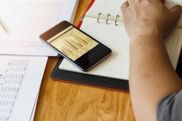 A freelancer using a mobile app to track expenses and income. The app displays charts and graphs showing financial progress.