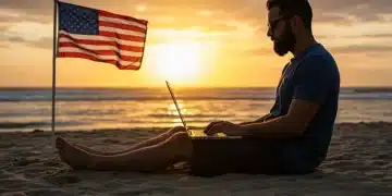 Digital nomad working remotely on a beach with a U.S. flag in the background, symbolizing U.S. domicile.