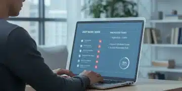 Person focused at laptop with digital focus wall